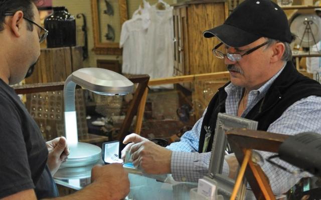 Antique seller and customer